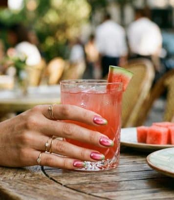 ParisSelectBook - Watermelon nails with cat-eye shimmer and tiny pearls are quietly becoming the summer manicure everyone screenshots