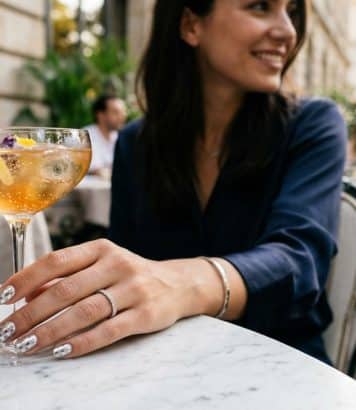 Dua Lipa brings back the metallic polka dot manicure as the nail trend of the summer