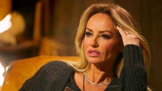 Adriana Karembeu embraces her dark roots over platinum blonde at 54