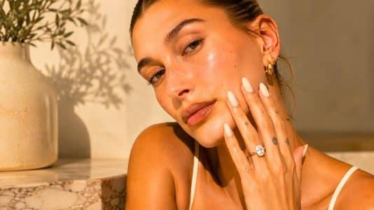 Hailey Bieber is wearing the vanilla milk manicure, summer's softest nail trend