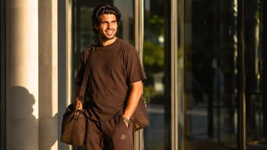 Carlos Alcaraz arrives at the US Open in a head-to-toe brown look by Travis Scott x Nike