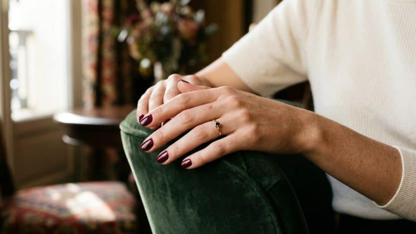 Marine Delterme is wearing this bordeaux Chanel nail polish that already signals autumn